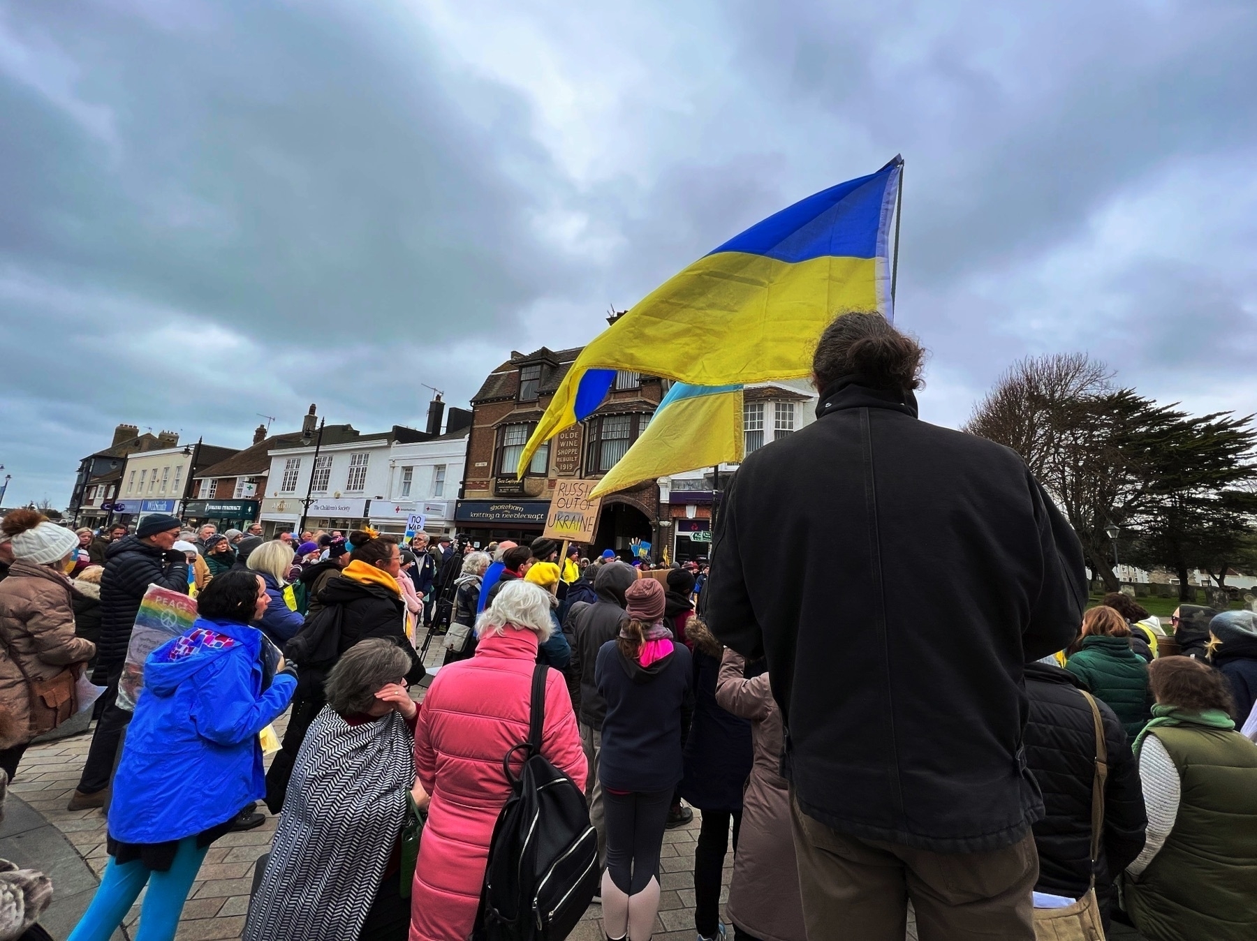 A Ukraine flag flying above a protest in Shoreham-by-Sea.